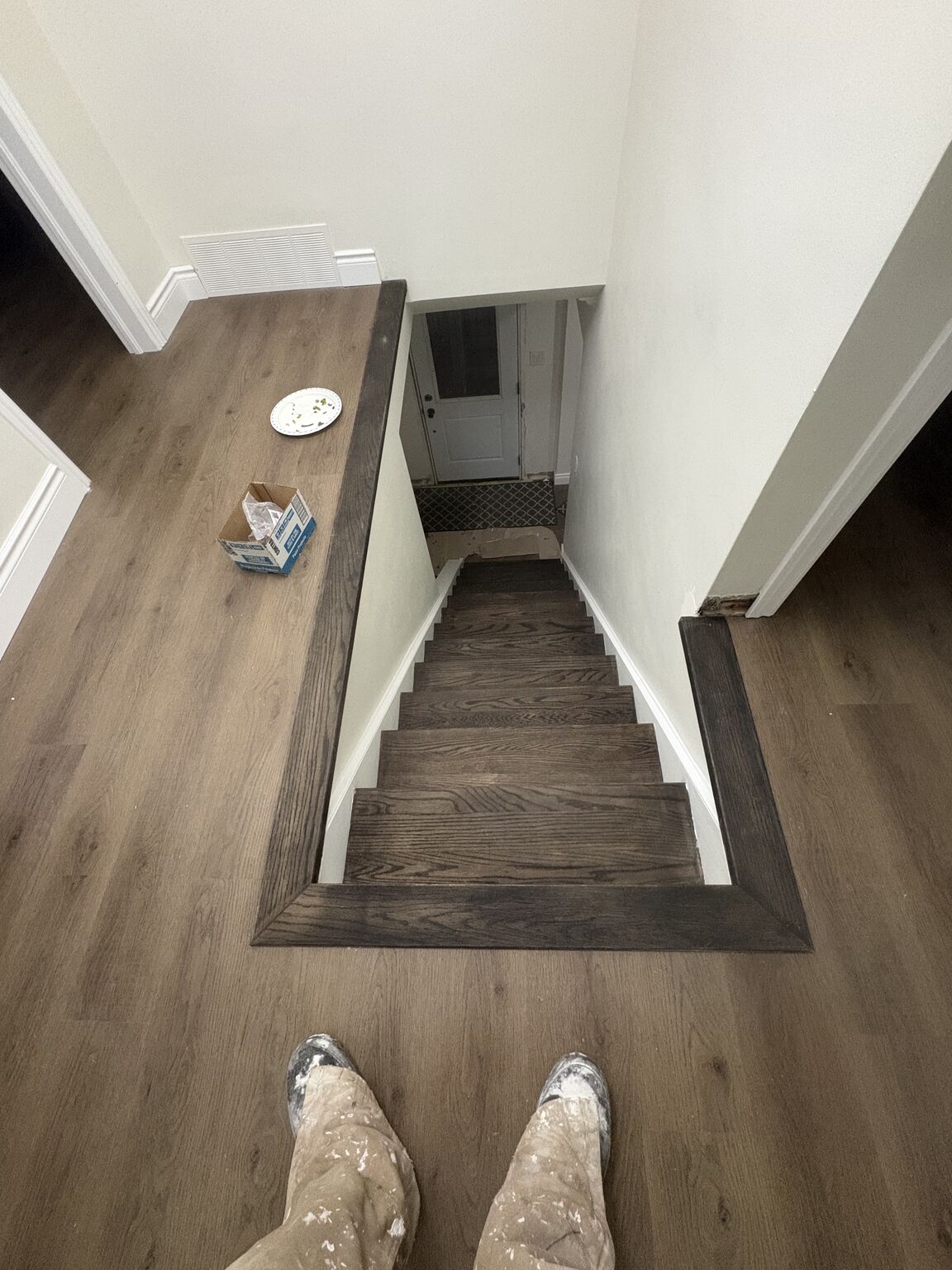 Dark stained hardwood stairs looking down from upper level - home renovation Cambridge Ontario