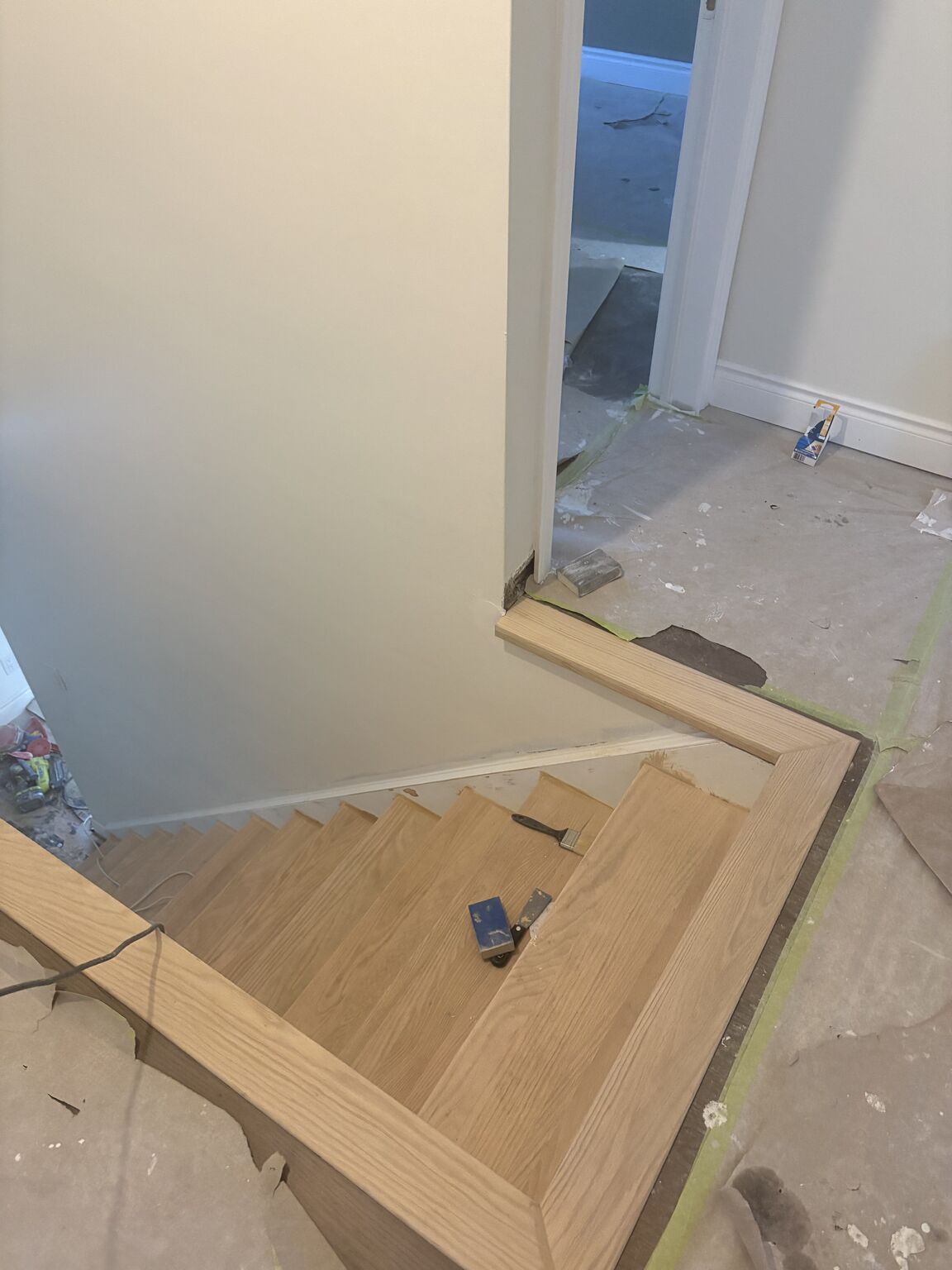 Oak stair treads being custom fitted and installed - construction in progress Cambridge Ontario